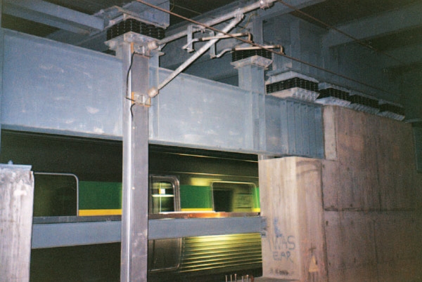 Train in motion between isolated crash walls